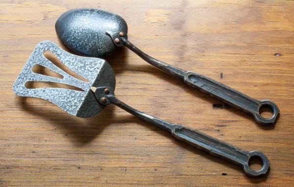 Hand forged spoon and spatula with bronze handles, back view