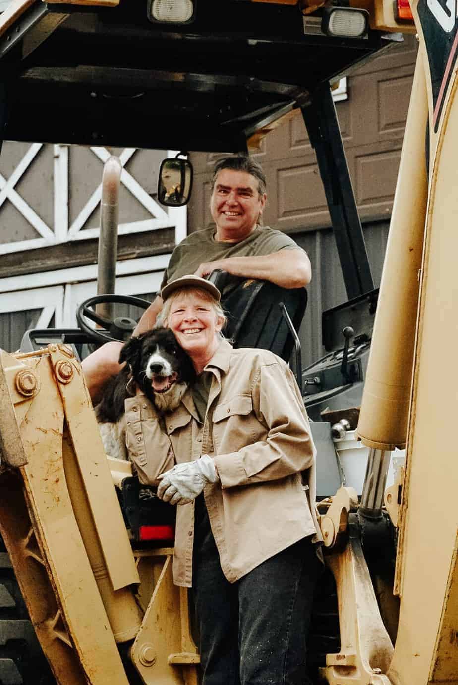Sue & Peter of Northwest Skillet Company on backhoe with Nap the dog.
